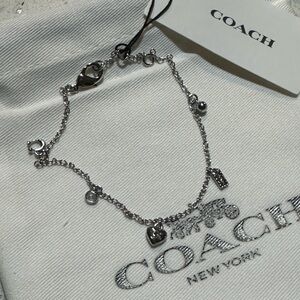 NEW! Coach – Charm Bracelet in silver / new in branded pouch